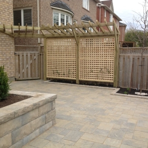 interlock patio and wooden fence