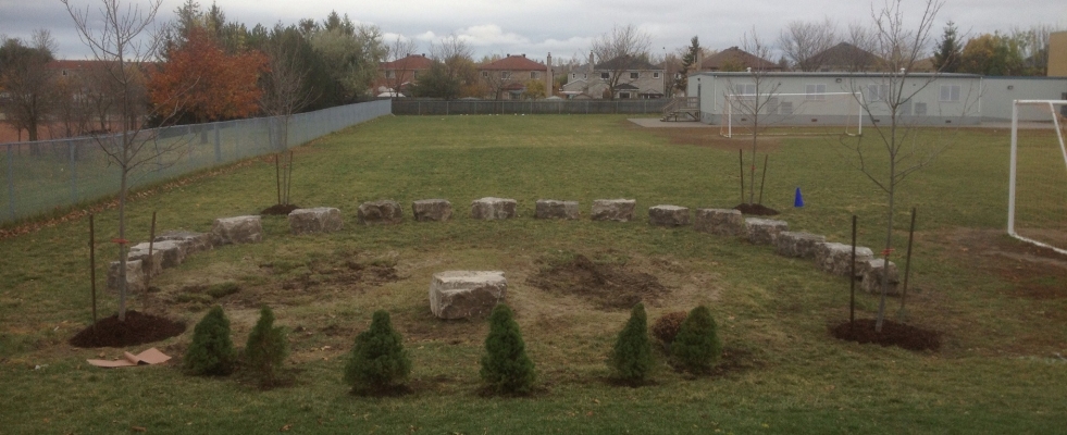 Community stone and tree landscaping