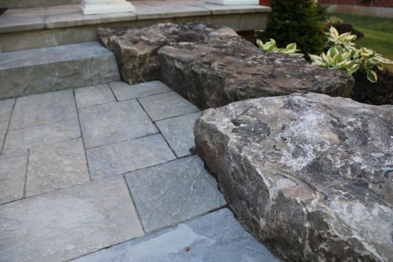 Contour cuts between pavers and armour stone