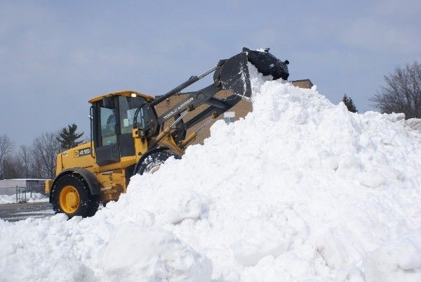 Snow Removal with a CAT 416 Loader