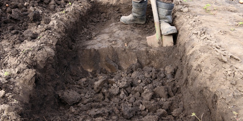 Man digging a pit